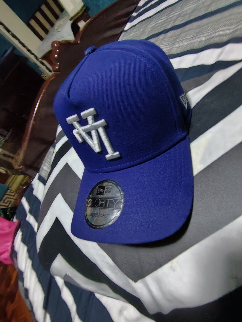 New Era 9FORTY LA Dodgers Blue Adjustable Cap (Category: Caps & Hats) located in Manila. Submitted by snooks1938 (Listing ID 1470116480, Image 2). Description: Up For Sale.. NEW ERA LA CAP UPSIDE DOWN LOGO EDITION.. GUARANTEED AUTHENTIC OR TRIPLE UR MONEY BACK.. GUARANTEED.. - Brand: New Era 9FORTY - Color: Royal Blue with White LA Dodgers embroidery - Details: Small New Era flag logo on the side - Condition: Brand new with flat sticker still att