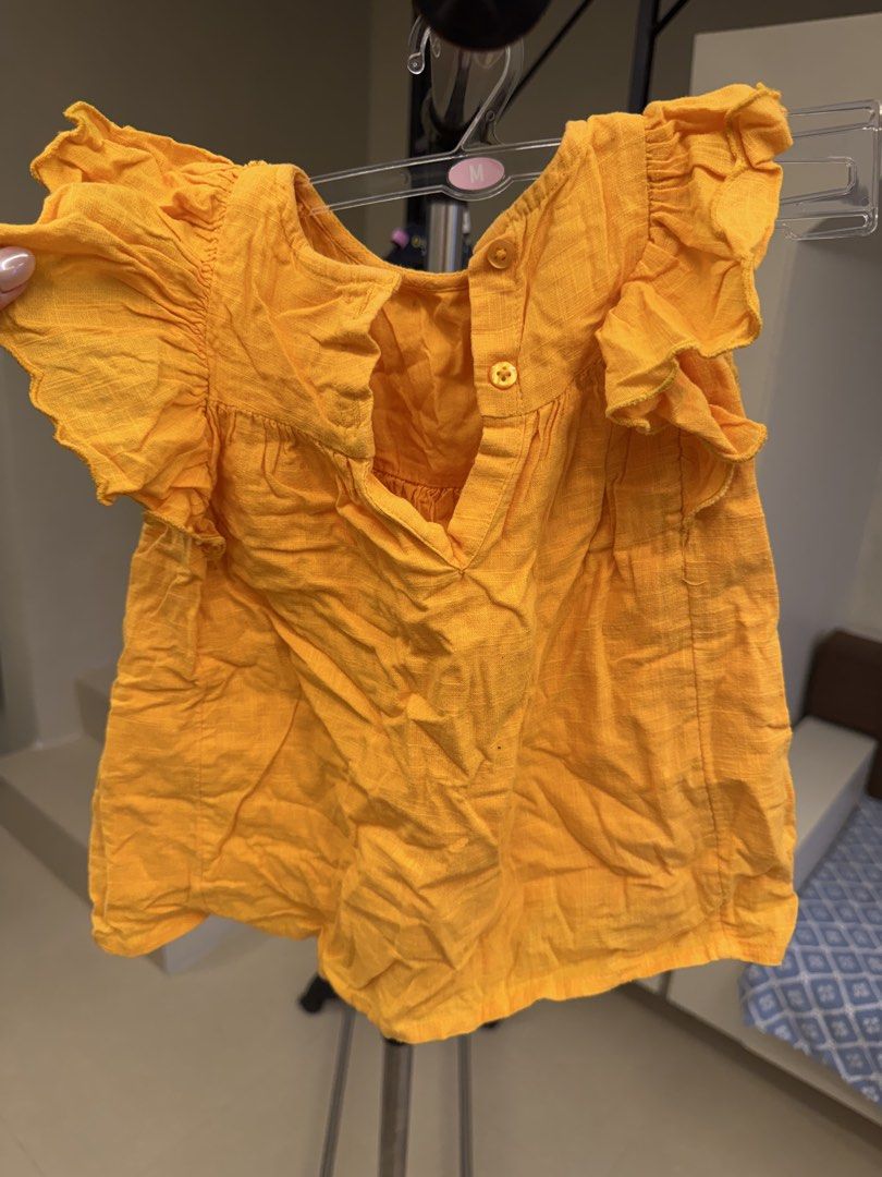 Next Mustard Yellow Cotton Blouse 6-9 Months (Category: Babies & Kids Fashion) located in Manila. Submitted by __nix (Listing ID 1469999985, Image 2). Description: - Brand: Next - Size: 6-9 months (fits up to 9.5kg / 21lbs) - Color: Bright mustard yellow - Material: 100% cotton shell and lining - Design: Flutter sleeves with charming floral embroidery down the front - Closure: Convenient button closure at the back neck - Care: Machine washable fo
