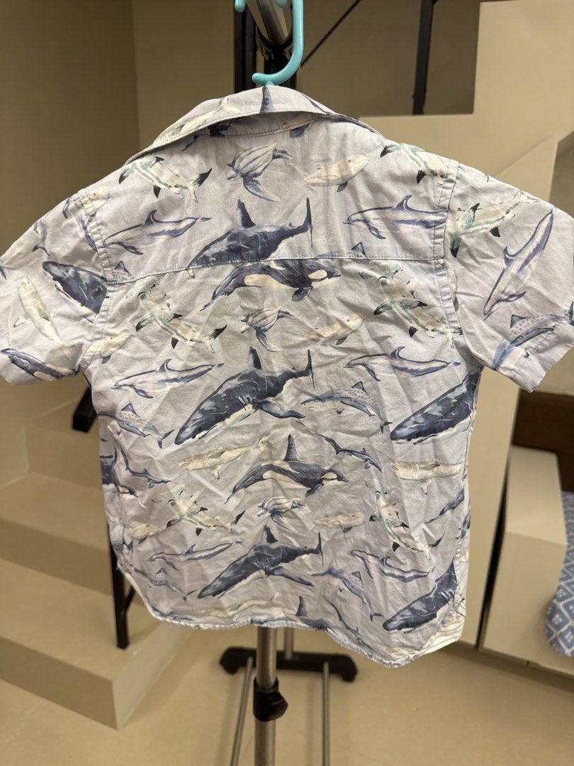 Next Shark Print Short Sleeve Shirt (Category: Babies & Kids Fashion) located in Manila. Submitted by __nix (Listing ID 1470013722, Image 1). Description: - Brand: Next - Style: Short-sleeve button-up shirt - Color/Design: Light blue with all-over shark and marine animal print - Details: Collar neck with blue stripe interior lining - Material: Lightweight fabric - Condition: Great for casual summer wear.