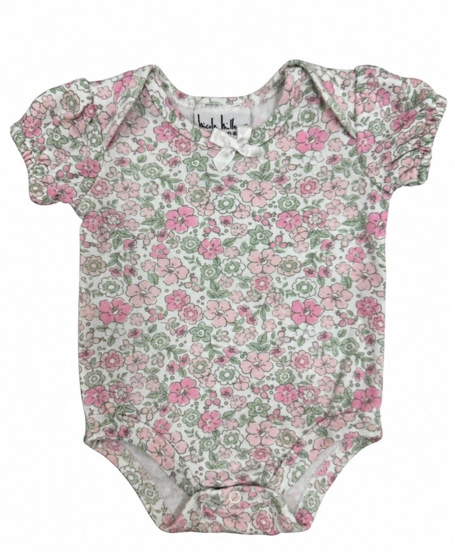 Nicole Miller Onesie (0-3M) (Category: Babies & Kids Fashion) located in Angeles City. Submitted by aeapreloved (Listing ID 1470049777, Image 1). Description: Nicole Miller New York Floral Onesie 🌸 • Size: 0–3 months • White base with pink and green floral print • Cute puff sleeves with satin bow detail • Soft, lightweight fabric • Three snap-button closure for easy diaper changes Preloved baby clothes, perfect for everyday wear! 💕.