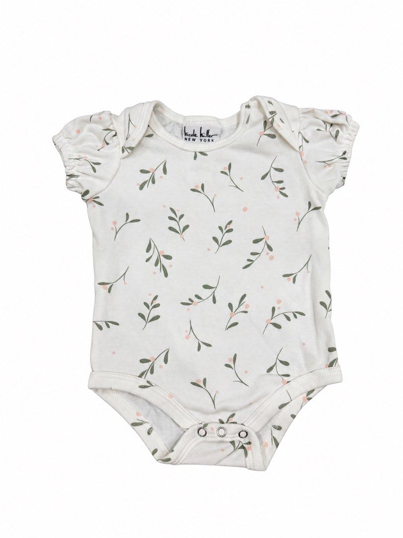 Nicole Miller Onesie (3-6M) (Category: Babies & Kids Fashion) located in Angeles City. Submitted by aeapreloved (Listing ID 1469986057, Image 1). Description: Nicole Miller New York Baby Floral Bodysuit 🌿🤍 • Size: 3–6 months • Cream with delicate sage green leaves and blush pink accents • Cute puff sleeves • Soft, comfortable fabric • Snap-button closure for easy diaper changes.