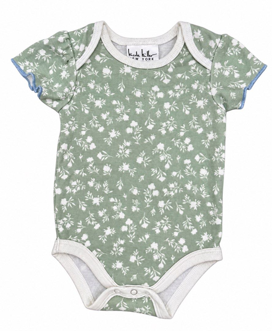 Nicole Miller Onesie (3-6M) (Category: Babies & Kids Fashion) located in Angeles City. Submitted by aeapreloved (Listing ID 1470034686, Image 1). Description: Nicole Miller New York Floral Onesie 🌿 • Size: 3–6 months • Sage green with white floral print • Short sleeves with blue trim • Soft, lightweight fabric • Envelope neckline for easy dressing • Bottom snap-button closure for convenient diaper changes Preloved baby clothes, perfect for every