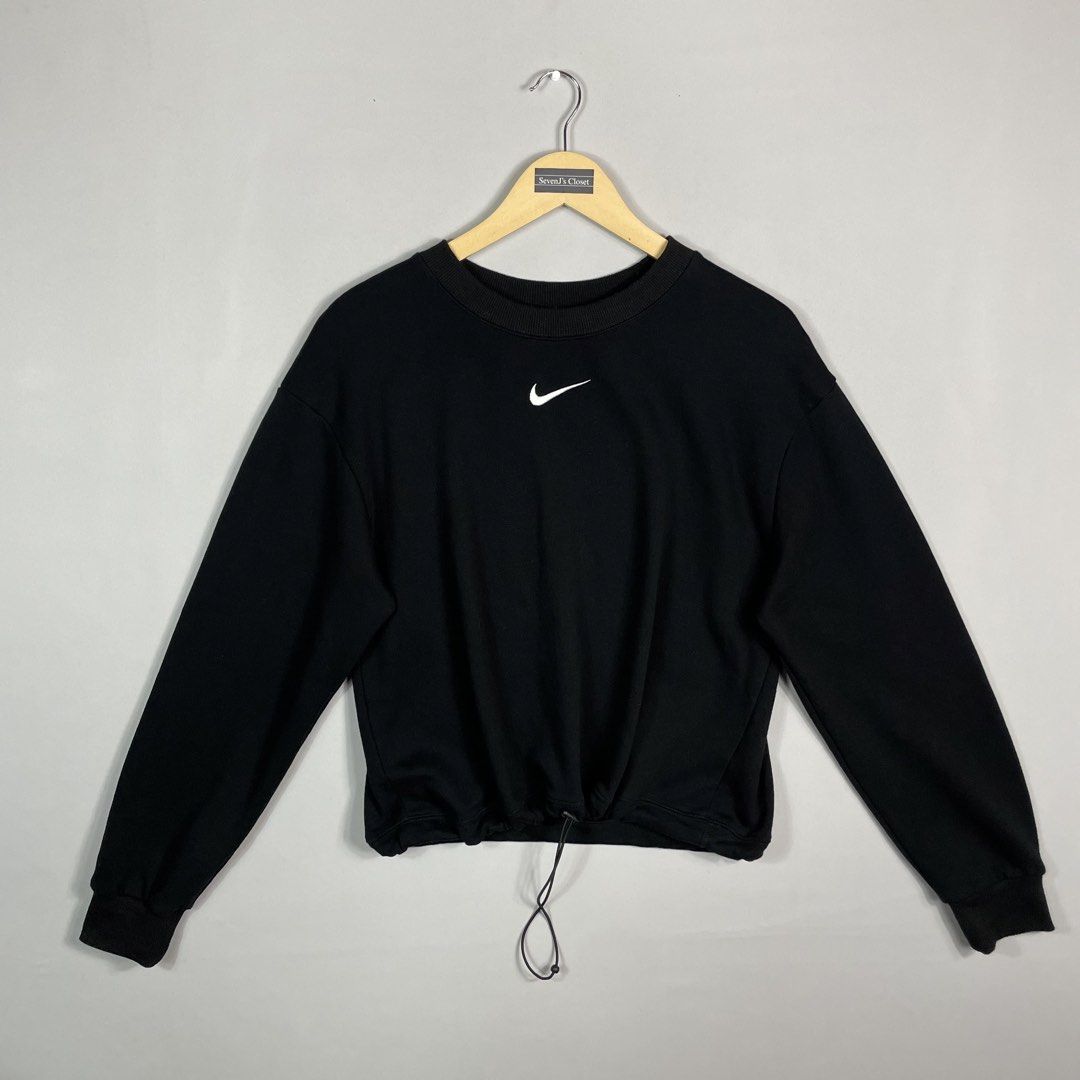 NIKE | Black Drawstring Crewneck (Category: Coats, Jackets and Outerwear) located in Norzagaray. Submitted by sevenjscloset (Listing ID 1470008722, Image 1). Description: - Brand/Item: Nike Black Drawstring Crewneck Sweatshirt - Design: Small embroidered white swoosh on chest, large swoosh print on back - Fit Feature: Adjustable drawstring hem for a customized fit - Measurements: Length 22 inches, Width 17.5 inches - Model Reference: 5'2" tall, 5