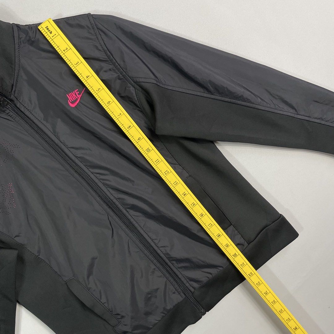 NIKE | Black Lightweight Jacket (Category: Coats, Jackets and Outerwear) located in Manila. Submitted by sevenjscloset (Listing ID 1470000446, Image 3). Description: - Brand: Nike - Color: Black with pink accents - Size: XL on tag (Measures 22" length x 17" width) - Features: Full zip closure, high collar, front pockets, front chest graphic, and large Nike spellout on the back - Condition: 9/10, flawless and well-maintained - Lightweight and styl