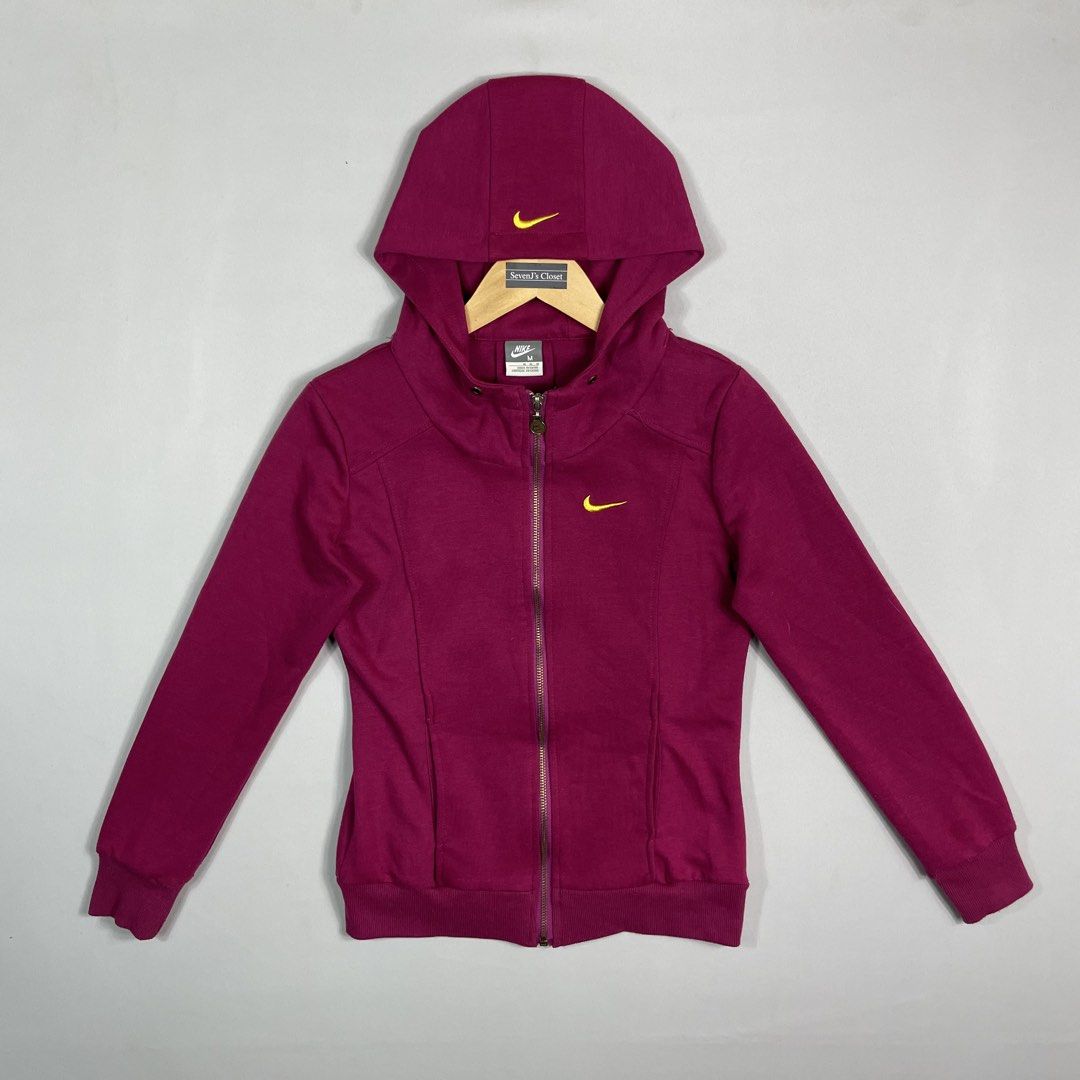 NIKE | Maroon Zip-Up Hoodie (Category: Coats, Jackets and Outerwear) located in Manila. Submitted by sevenjscloset (Listing ID 1470001904, Image 1). Description: - Brand/Style: Authentic Maroon Nike Zip-Up Hoodie - Details: Yellow embroidered Swoosh logo, zip closure, adjustable drawstring hood, and front pockets - Size on tag: Medium - Actual measurements: 21 inches (length) x 15 inches (width) - Model reference: 5'2" height, 50kg weight - Condi