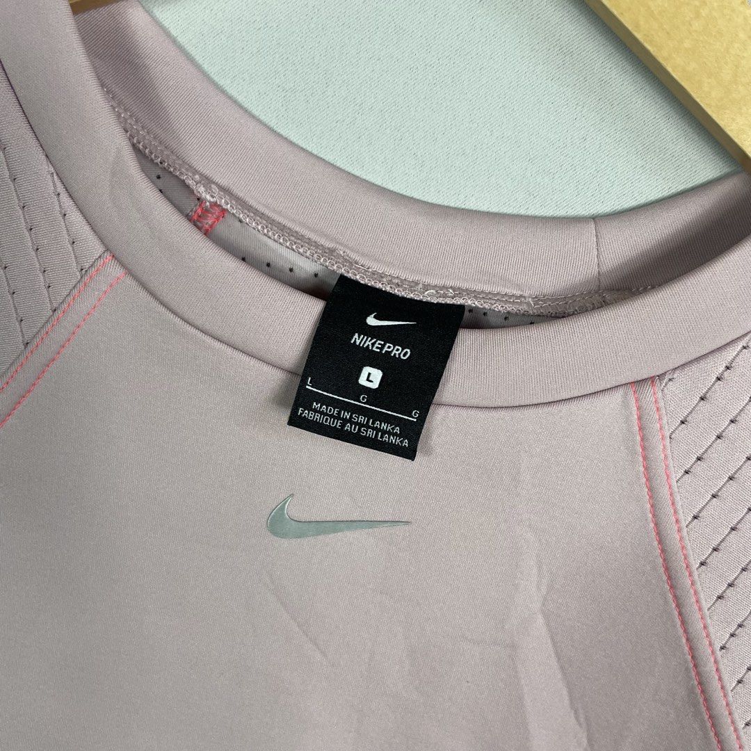 NIKE | Pink Cropped Crewneck (Category: Coats, Jackets and Outerwear) located in Manila. Submitted by sevenjscloset (Listing ID 1469998865, Image 2). Description: - Item: Nike Pink Cropped Crewneck Sweatshirt - Size: L (Measures 18.5" length x 21" width) - Fit Reference: Model is 5'4" and 61kg - Condition: 9/10, flawless and super comfy - Features: Ribbed sleeves and front kangaroo pocket.
