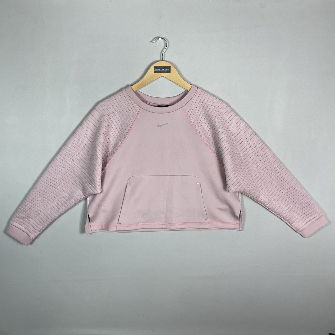 NIKE | Pink Cropped Crewneck (Category: Coats, Jackets and Outerwear) located in Manila. Submitted by sevenjscloset (Listing ID 1469998865, Image 1). Description: - Item: Nike Pink Cropped Crewneck Sweatshirt - Size: L (Measures 18.5" length x 21" width) - Fit Reference: Model is 5'4" and 61kg - Condition: 9/10, flawless and super comfy - Features: Ribbed sleeves and front kangaroo pocket.