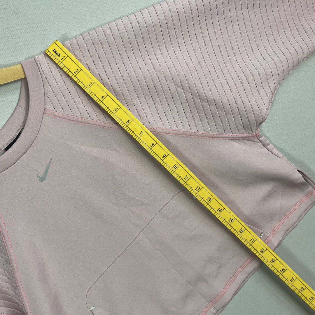 NIKE | Pink Cropped Crewneck (Category: Coats, Jackets and Outerwear) located in Manila. Submitted by sevenjscloset (Listing ID 1469998865, Image 3). Description: - Item: Nike Pink Cropped Crewneck Sweatshirt - Size: L (Measures 18.5" length x 21" width) - Fit Reference: Model is 5'4" and 61kg - Condition: 9/10, flawless and super comfy - Features: Ribbed sleeves and front kangaroo pocket.