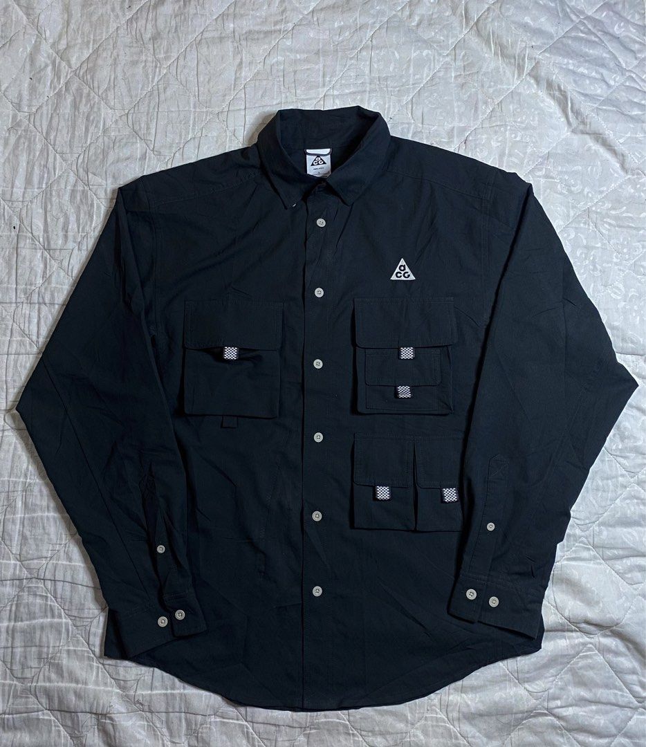 Nike ACG Devastation Trail Long Sleeve Cargo Shirt (Category: Coats, Jackets and Outerwear) located in Santa Cruz. Submitted by xaviers-thrift (Listing ID 1470098630, Image 2). Description: - Brand: Nike ACG - Model: Devastation Trail Long Sleeve Shirt - Color: Black - Size: Large (L) - Fabric: Dri-FIT technology to keep you dry - Details: Multiple utility cargo pockets on the chest with carabiner clip detail, button-up front, classic collar - Or
