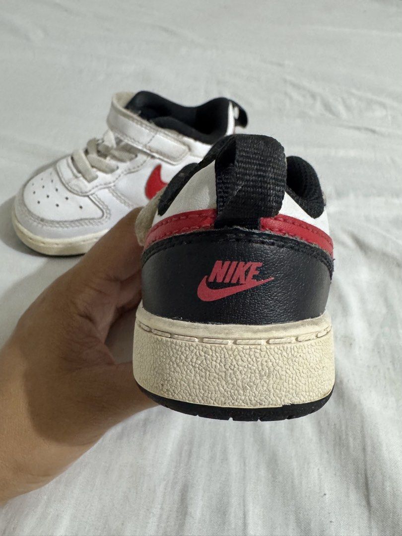 Nike Baby Shoes (Category: Babies & Kids Fashion) located in Paranaque City. Submitted by april_anythingpreloved (Listing ID 1470098470, Image 3). Description: - Brand/Style: Nike White leather sneakers with red swoosh and black heel tab - Size: US 6C, UK 5.5, EUR 22 (Toddler) - Closure: Easy velcro strap over elastic laces for quick wear - Condition: Pre-loved with sole yellowing and toe wear from normal use; Few stitches removed in front part o