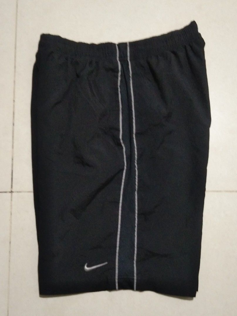 Nike Black Athletic Shorts Size L (Category: Shorts) located in Manila. Submitted by aj.bermundo (Listing ID 1470019796, Image 2). Description: - Brand: Nike - Item: Athletic Shorts - Color: Black with white side piping - Size: Large (L) - Material: 100% Polyester - Features: Elastic waistband, small Nike swoosh logo near hem - Style Code: 450771-010 - Origin: Made in China - Condition: Excellent / Ready to wear.