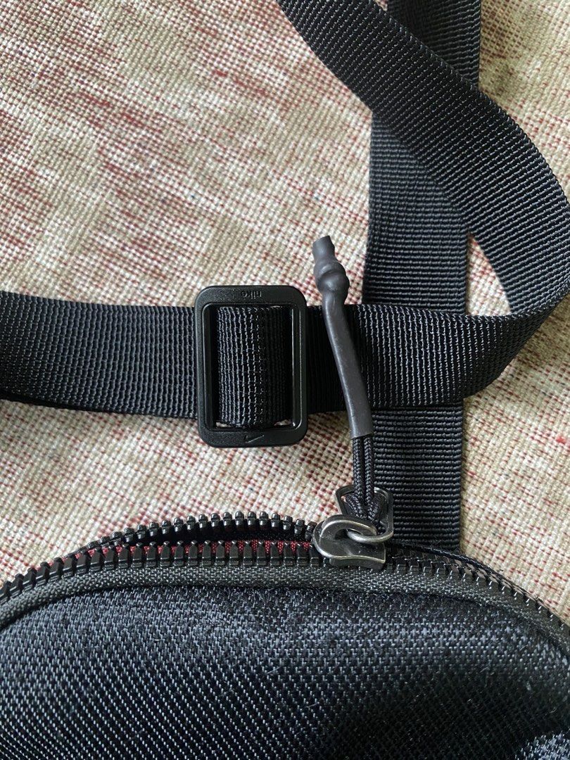 Nike Black Crossbody Bag (Category: Sling Bags) located in Manila. Submitted by diporosmoh43681 (Listing ID 1469976211, Image 3). Description: - Brand: Nike - Color: Classic black with white Nike logo - Material: Durable, high-quality nylon - Closure: Top zipper with black pull cord - Storage: Handy front mesh pocket for easy access - Strap: Fully adjustable for a comfortable fit - Perfect for: Carrying daily essentials like your phone, wallet, a