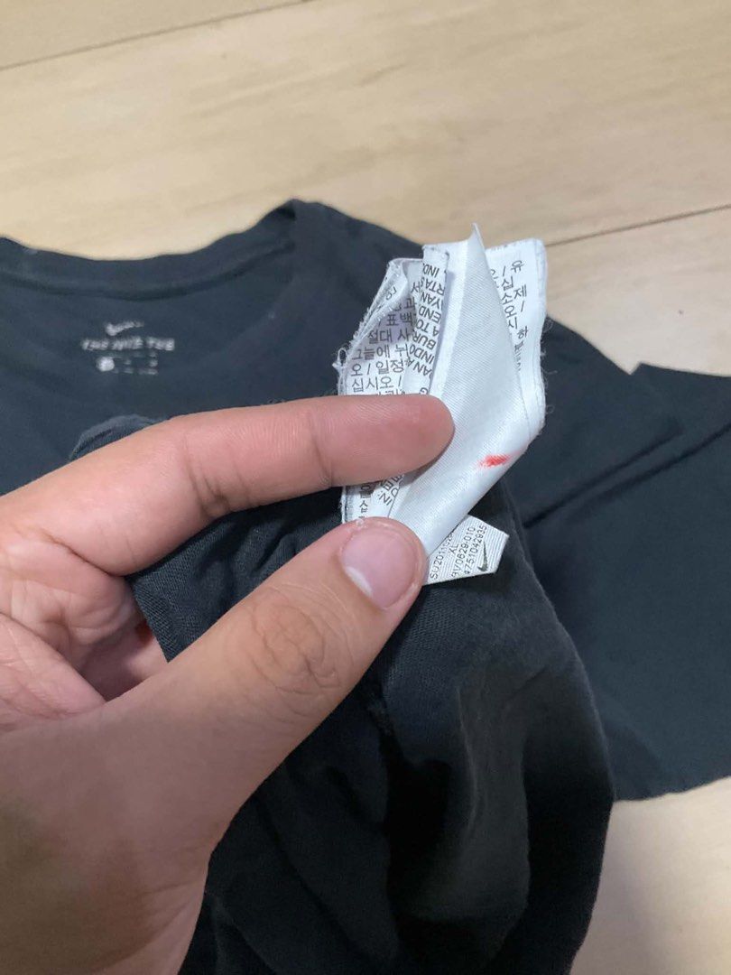 Nike Black Graphic Tee (Category: Tshirts & Polo Shirts ) located in Manila. Submitted by thrifty111 (Listing ID 1470091027, Image 3). Description: - Brand: Nike - Color: Black with large white logo on front - Size: XL - Design: Short sleeves, crew neck - Material: Comfortable cotton feel - Style: Classic everyday casual wear, easy to pair with jeans or shorts 21x27.5.