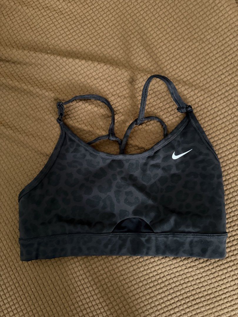 Nike Black Leopard Print Sports Bra (Category: Activewear) located in Pasay City. Submitted by gold1001 (Listing ID 1469958791, Image 1). Description: - Black with a subtle all-over leopard print pattern - Adjustable cross-back straps for a custom fit - Stylish small cutout detail at the front hem - Breathable mesh panel in the back - Iconic white Nike Swoosh logo on the left chest.
