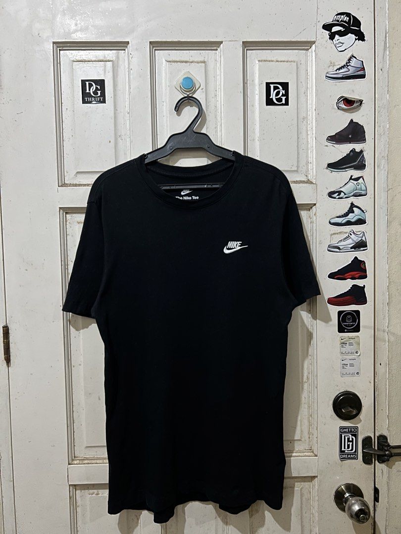 Nike Black Minimalist Swoosh Logo Tee (Category: Tshirts & Polo Shirts ) located in Pasay City. Submitted by deguzmanjay (Listing ID 1470070917, Image 1). Description: - Brand: Nike - Color: Solid black - Design: Small embroidered white swoosh logo on left chest - Material: Soft, comfortable cotton - Fit: Standard casual fit - Condition: Clean, great staple piece for daily wear.