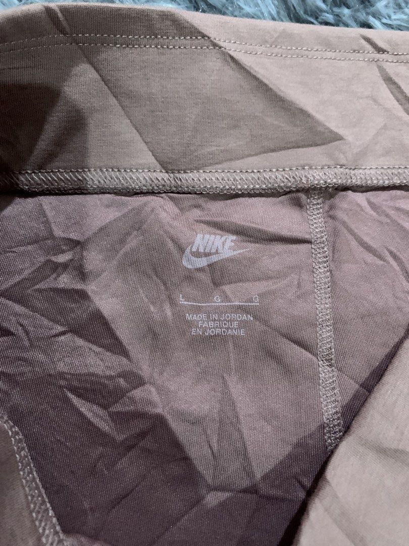 Nike Brown Biker Shorts Size L (Category: Shorts) located in Iba. Submitted by thriftcoyan (Listing ID 1470004558, Image 3). Description: - Authentic Nike biker shorts in dusty pink - Size L (tag printed inside for comfort) -30-33 -Length 18 - Classic printed Swoosh logo near the left hem - Comfortable stretchy elastic waistband - Made in Jordan - Versatile for workouts, gym sessions, or casual home lounging - Condition: Excellent.