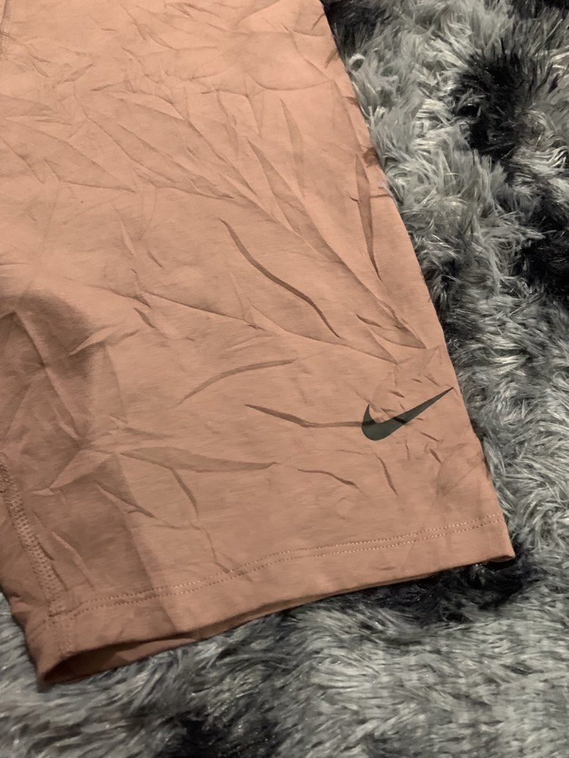 Nike Brown Biker Shorts Size L (Category: Shorts) located in Iba. Submitted by thriftcoyan (Listing ID 1470004558, Image 2). Description: - Authentic Nike biker shorts in dusty pink - Size L (tag printed inside for comfort) -30-33 -Length 18 - Classic printed Swoosh logo near the left hem - Comfortable stretchy elastic waistband - Made in Jordan - Versatile for workouts, gym sessions, or casual home lounging - Condition: Excellent.