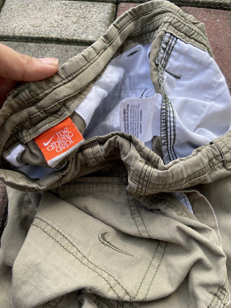 Nike Cargo Shorts (Olive Green) (Category: Shorts) located in Naga. Submitted by marcbiench83020 (Listing ID 1470095513, Image 3). Description: Nike cargo Pants (Olive Green) Length: 23 Width: 34-36 Condition: Good Condition Color Rate: 9/10 Issue: Missing button left pocket .