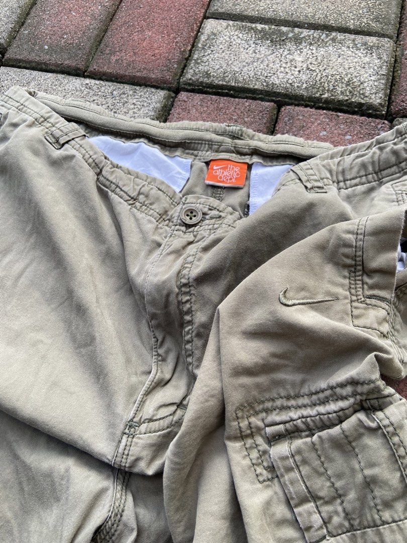 Nike Cargo Shorts (Olive Green) (Category: Shorts) located in Naga. Submitted by marcbiench83020 (Listing ID 1470095513, Image 2). Description: Nike cargo Pants (Olive Green) Length: 23 Width: 34-36 Condition: Good Condition Color Rate: 9/10 Issue: Missing button left pocket .
