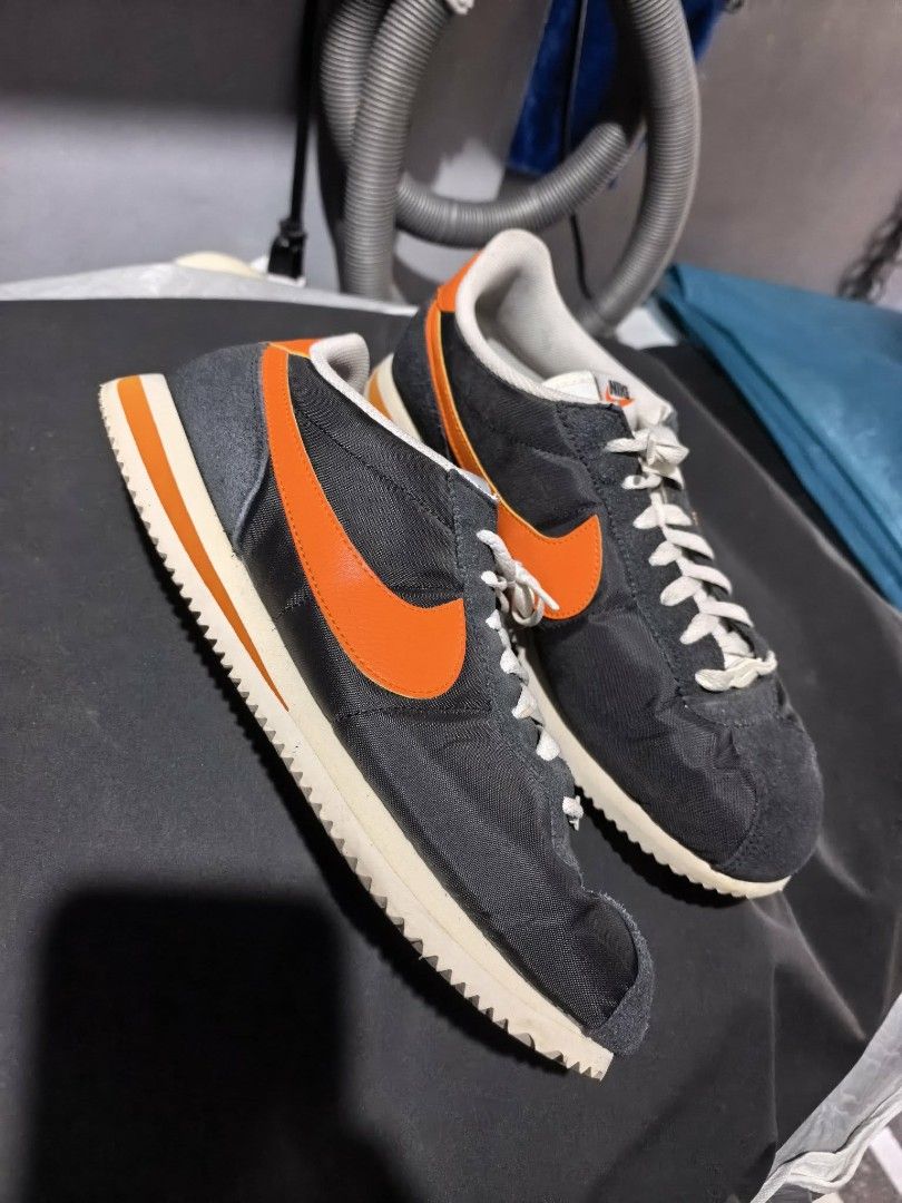 Nike Cortez Nylon Black Orange Sneakers (Category: Casual Shoes) located in Manila. Submitted by anjbrtlm (Listing ID 1470021638, Image 3). Description: - Brand/Model: Nike Cortez retro running sneakers - Colorway: Black nylon upper with bright orange swoosh and white laces - Size: US 9.5 / UK 8.5 / EUR 43.5 / CM 27.5 - Features: Iconic textured soles and timeless vintage design.