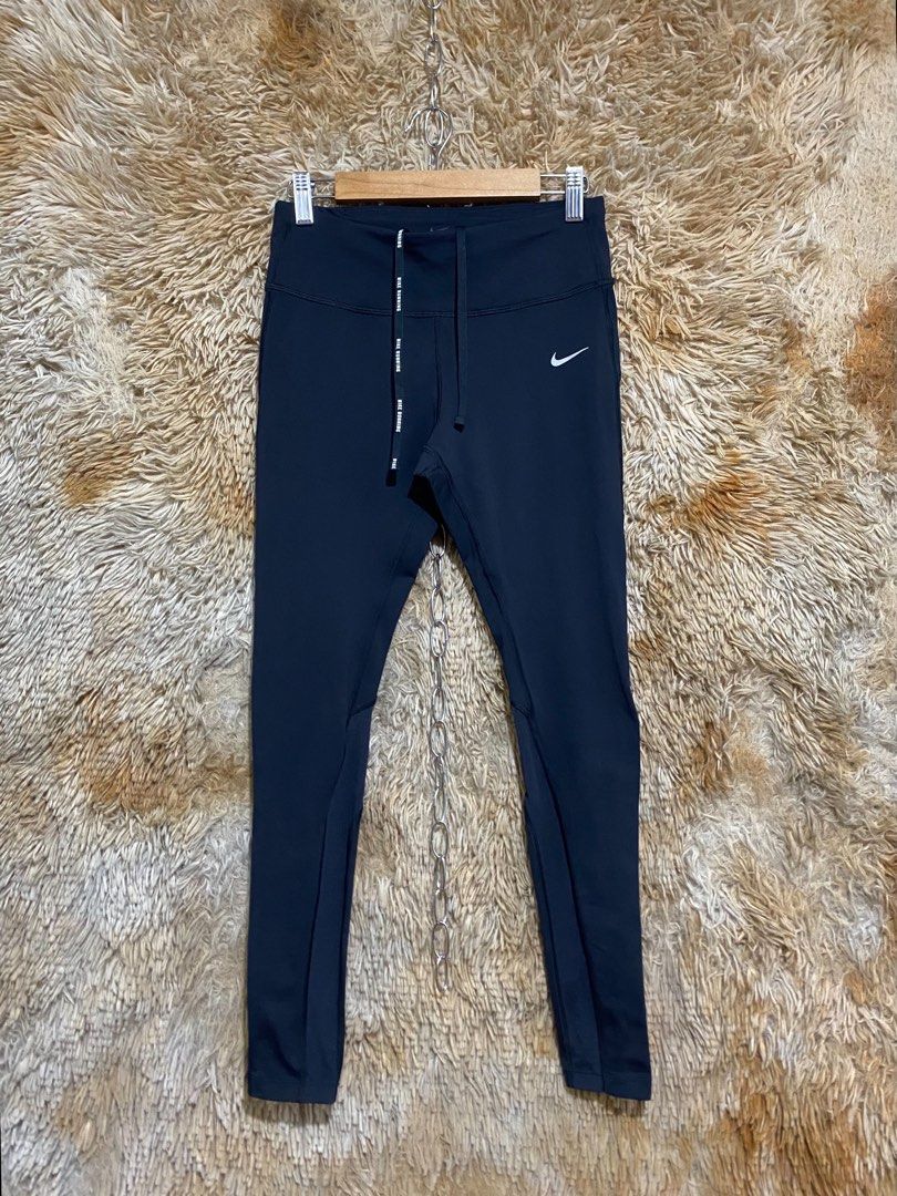 Nike Dri-FIT Running Leggings Black (Category: Activewear) located in Butuan. Submitted by jc13thrifts (Listing ID 1469962810, Image 1). Description: - Brand: Nike - Color: Black - Technology: Dri-FIT moisture-wicking material - Fit: Slim fit with super stretchy fabric for maximum mobility - Waistband: Adjustable drawstring featuring repeated Nike Running lettering - Storage: Convenient back waist zipper pocket for essentials - Safety: Reflective