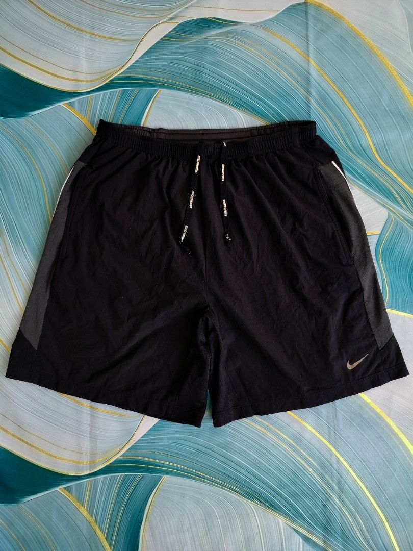 Nike Dri-FIT Running Shorts Black Size M (Category: Shorts) located in Manila. Submitted by geraldquinto_917 (Listing ID 1470080686, Image 2). Description: - Brand: Nike - Color: Black - Size: Medium -Waist 28-36 -Length 16 -Leg Opening 13 - Dri-FIT fabric keeps you dry and comfortable during workouts - Elastic waistband with adjustable Nike Running drawstring - Mesh side panels for enhanced breathability - Reflective Swoosh logo near the hem for