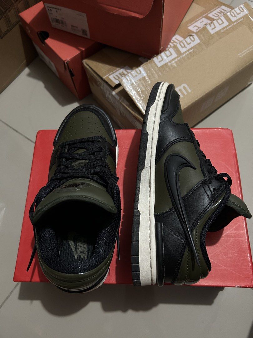 Nike Dunk Low Twist Medium Olive Black (Category: Sneakers) located in Quezon City. Submitted by jamsweetjam (Listing ID 1470036742, Image 2). Description: Nike Dunk Low in medium olive and black colourway. Classic low-top basketball silhouette with leather upper. Puffy tongue with embossed Nike logo patch. Clean white midsole paired with a dark outsole. Black laces threaded through the front. Minor wear along the edges of the sole, otherwise sol