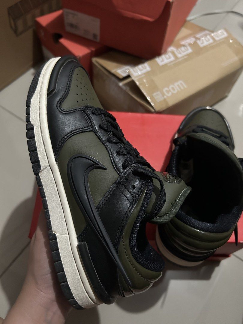 Nike Dunk Low Twist Medium Olive Black (Category: Sneakers) located in Quezon City. Submitted by jamsweetjam (Listing ID 1470036742, Image 1). Description: Nike Dunk Low in medium olive and black colourway. Classic low-top basketball silhouette with leather upper. Puffy tongue with embossed Nike logo patch. Clean white midsole paired with a dark outsole. Black laces threaded through the front. Minor wear along the edges of the sole, otherwise sol