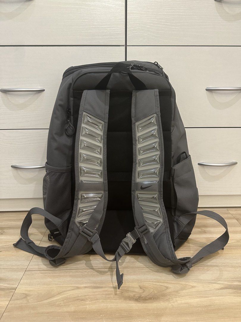 Nike Elite Bag V3 - Gray (Category: Backpacks) located in Antipolo. Submitted by kicksnmists.ph (Listing ID 1470100537, Image 2). Description: - Brand: Nike Elite Backpack - Color: Dark grey with bold vertical ELITE branding - Comfort: Air Max cushioning in shoulder straps for heavy loads + adjustable sternum strap - Storage: Spacious main compartment, front pocket, and mesh side water bottle pocket - Durability: Tough black bottom panel - Condit