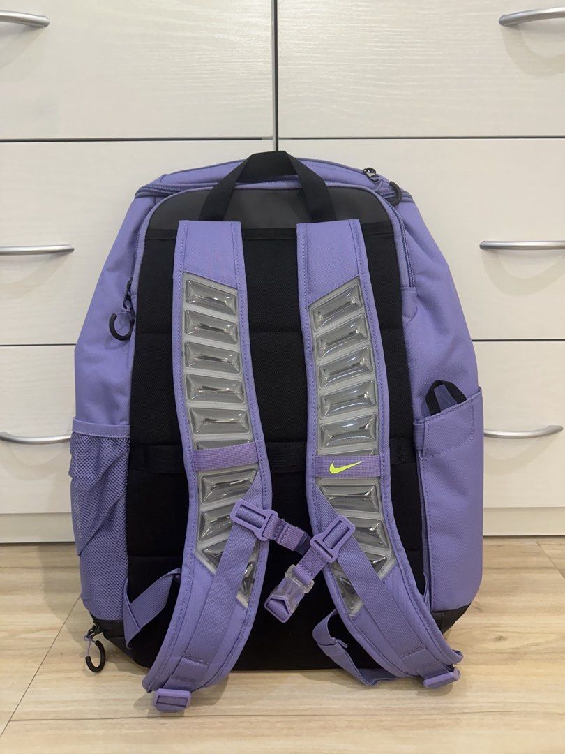 Nike Elite Bag V3 - Purple Amethyst (Category: Backpacks) located in Antipolo. Submitted by kicksnmists.ph (Listing ID 1470100566, Image 2). Description: - Authentic Nike Elite Backpack in Purple and Lime Green - Large 32L capacity with spacious main compartment - Style code: HM9965-527 (Original hangtag attached) - Convenient mesh side pockets for water bottles or essentials - Comfortable padded shoulder straps for all-day wear - Ideal for schoo