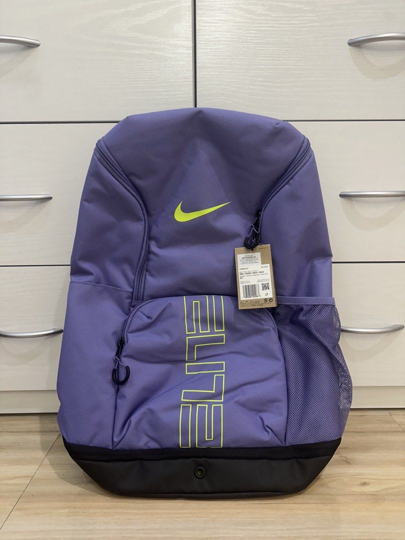 Nike Elite Bag V3 - Purple Amethyst (Category: Backpacks) located in Antipolo. Submitted by kicksnmists.ph (Listing ID 1470100566, Image 1). Description: - Authentic Nike Elite Backpack in Purple and Lime Green - Large 32L capacity with spacious main compartment - Style code: HM9965-527 (Original hangtag attached) - Convenient mesh side pockets for water bottles or essentials - Comfortable padded shoulder straps for all-day wear - Ideal for schoo