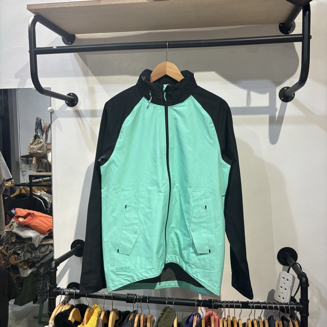 Nike GORE-TEX Paclite Shell Jacket Black Mint Green (Category: Coats, Jackets and Outerwear) located in Bambang. Submitted by heats777 (Listing ID 1470003801, Image 2). Description: - Authentic GORE-TEX Paclite Shell jacket in a sleek black and mint green colorway - Lightweight, weather-resistant material perfect for all-weather wear - Full zip front closure with a protective high collar - Convenient front pockets with secure flap and snap detail