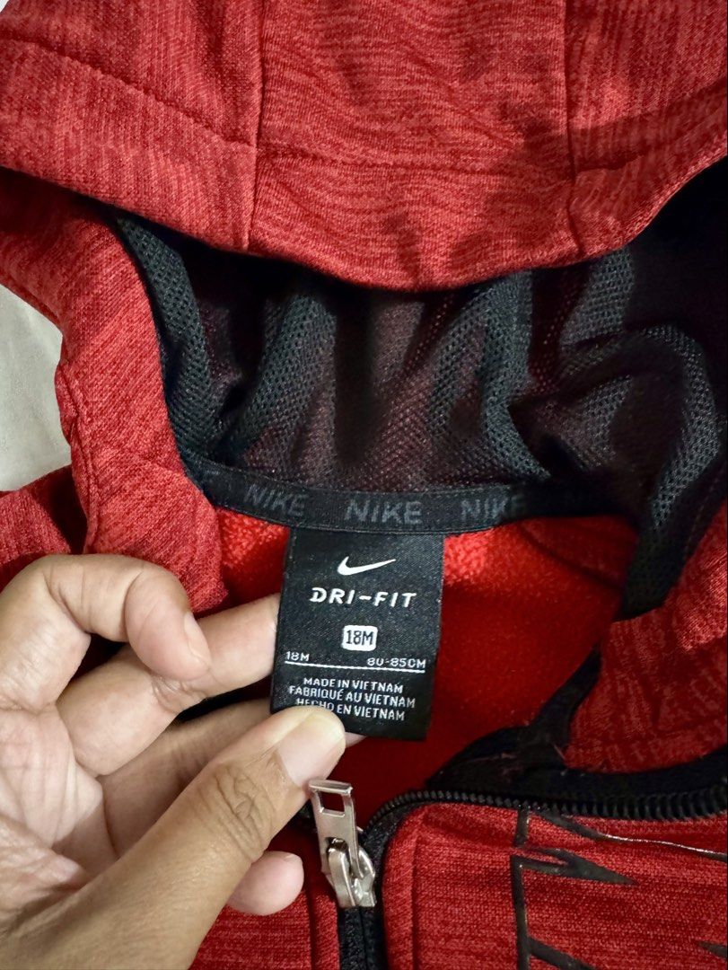 Nike Baby Jacket (Category: Babies & Kids Fashion) located in Paranaque City. Submitted by april_anythingpreloved (Listing ID 1467477376, Image 2). Description: - Brand: Nike Authentic - Color: Red - Size: 18 months on tag (but can fit up to 3 years old) - Material: Dri-FIT (sweat-wicking) - Design: Big vertical Nike logo on chest with small swoosh near shoulder - Features: Full zip closure, attached hood, and front pockets Bought in the US - RFS