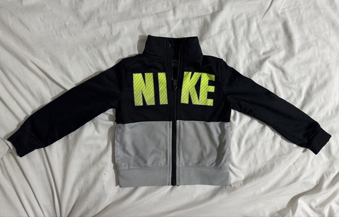 Nike Baby Jacket (Category: Babies & Kids Fashion) located in Paranaque City. Submitted by april_anythingpreloved (Listing ID 1467477915, Image 1). Description: - Authentic Kids Nike full zip jacket - Size on tag: 2T (can fit up to 3 years old) - Stylish black top with neon green logo & grey bottom half - High collar and full front zip closure for extra warmth - Soft, comfortable athletic fabric - Bought in the US - RFS: Decluttering -Location: P