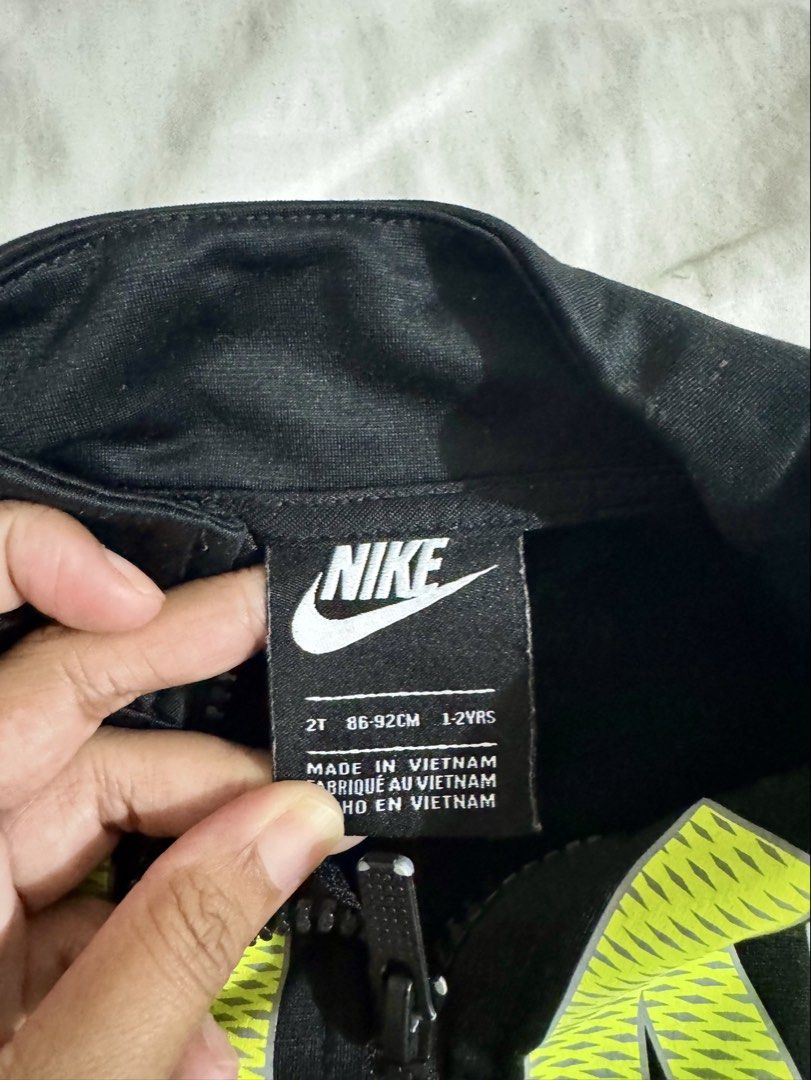 Nike Baby Jacket (Category: Babies & Kids Fashion) located in Paranaque City. Submitted by april_anythingpreloved (Listing ID 1467477915, Image 2). Description: - Authentic Kids Nike full zip jacket - Size on tag: 2T (can fit up to 3 years old) - Stylish black top with neon green logo & grey bottom half - High collar and full front zip closure for extra warmth - Soft, comfortable athletic fabric - Bought in the US - RFS: Decluttering -Location: P