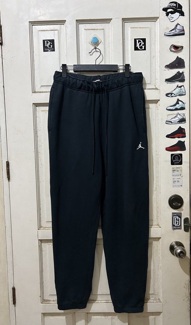 Nike Jordan Black Joggers Sweatpants (Category: Joggers) located in Pasay City. Submitted by deguzmanjay (Listing ID 1470070057, Image 1). Description: - Color: Solid black - Brand: Jordan - Material: Thick fleece lining for extra warmth - Features: Elastic waistband, adjustable drawstrings, and deep side pockets - Details: Small embroidered white Jumpman logo on the left thigh, ribbed ankle cuffs - Condition: Clean overall with no major flaws - 