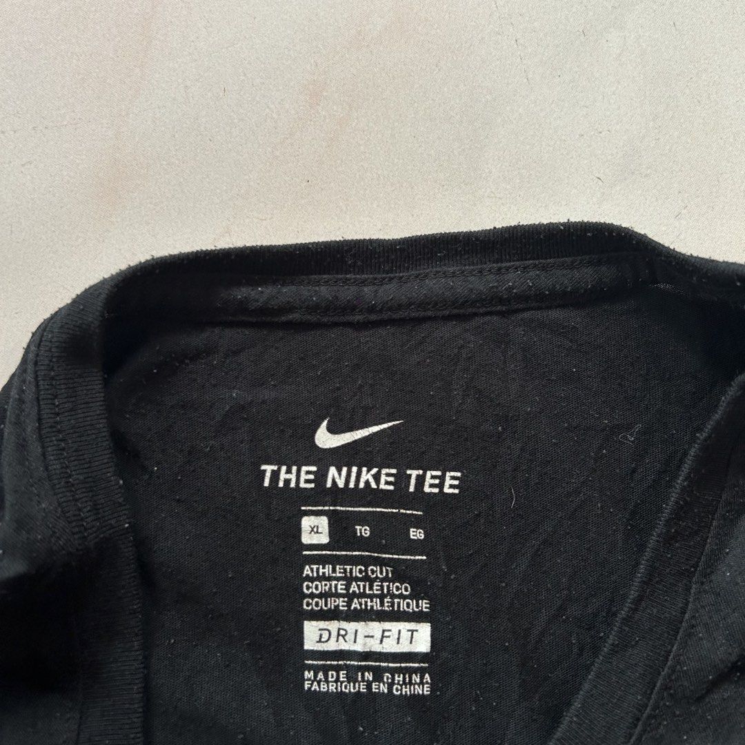 Nike Just Don't Quit 🔥 (Category: Tshirts & Polo Shirts ) located in Jinoba-an. Submitted by eegiboy (Listing ID 1470004304, Image 2). Description: - Brand: Nike - Item: Athletic T-Shirt - Size: Men's XL - Color: Black with light blue graphic ('JUST DON'T QUIT' with 'DON'T' crossed out) - Details: Small blue Nike swoosh on left sleeve, 'DRI-FIT' printed near hem - Material: 75% recycled polyester, 13% organic cotton, 12% rayon - Fit: Standard at