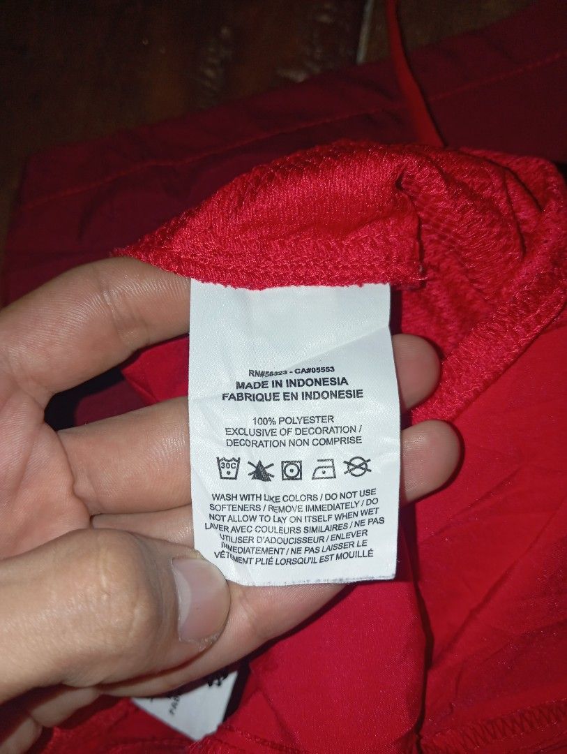 Nike Men's Dri-FIT Flex Woven Training Shorts (Category: Shorts) located in Guihulngan. Submitted by jaylordfra13193 (Listing ID 1470109992, Image 3). Description: - Brand: Nike Dri-FIT - Color: Red with burgundy contrast panel on lower right leg - Style Code: DM6617-657 - Size: Small (tag attached) - Material: 100% Polyester - Features: Elastic waistband with adjustable drawstring, dark Swoosh logo near hem - Origin: Made in Indonesia - Conditio
