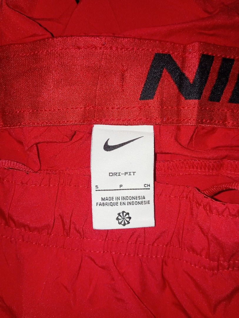 Nike Men's Dri-FIT Flex Woven Training Shorts (Category: Shorts) located in Guihulngan. Submitted by jaylordfra13193 (Listing ID 1470109992, Image 2). Description: - Brand: Nike Dri-FIT - Color: Red with burgundy contrast panel on lower right leg - Style Code: DM6617-657 - Size: Small (tag attached) - Material: 100% Polyester - Features: Elastic waistband with adjustable drawstring, dark Swoosh logo near hem - Origin: Made in Indonesia - Conditio