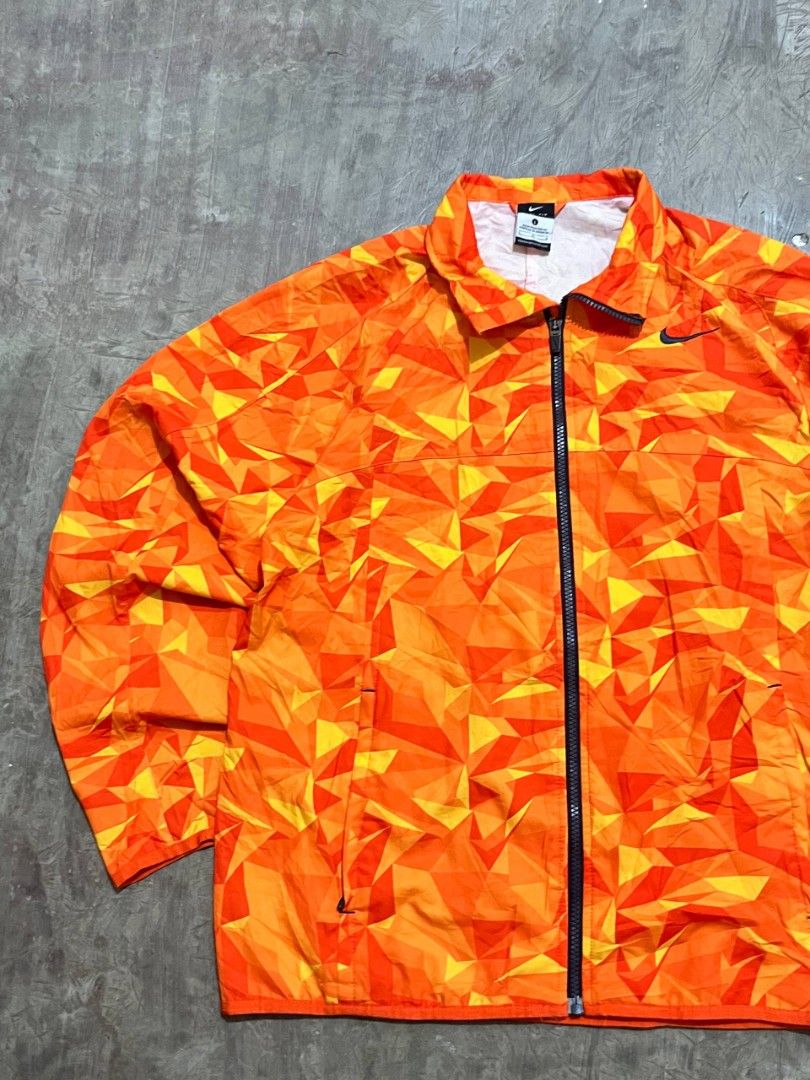 Nike Orange Geometric AOP Windbreaker Jacket (Category: Coats, Jackets and Outerwear) located in Cavite. Submitted by giankarl1608 (Listing ID 1470062822, Image 3). Description: Flaw: minor scratch W 22 L 27.