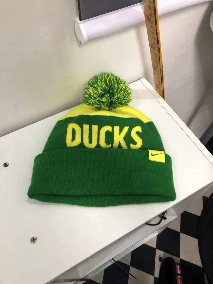 Nike Oregon Ducks Pom Beanie Green Yellow (Category: Caps & Hats) located in Manila. Submitted by ejaay_2012 (Listing ID 1470104206, Image 2). Description: - Authentic Nike Oregon Ducks winter beanie - Eye-catching green and yellow knit design with a playful pom pom - Features bold OREGON text on the front and DUCKS text on the back - Detailed Oregon Duck logo embroidery and Nike swoosh tag on the cuff - Made from 100% acrylic for maximum warmth 