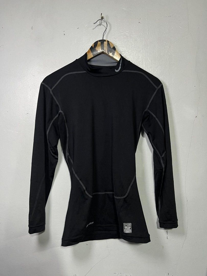 Nike Pro Combat Dri-Fit Compression Shirt Black Medium (Category: Activewear) located in Roxas, Mindoro Oriental. Submitted by oldschool_thriftph (Listing ID 1470108967, Image 1). Description: - Brand/Model: Nike Pro Combat Compression Shirt - Color: Black with grey detailing - Size: Medium - Dimes 15x25 - Style Code: 449833-010 - Material: Dri-FIT fabric for moisture-wicking and dry workouts - Design: Mock neck with branding on collar and lower 