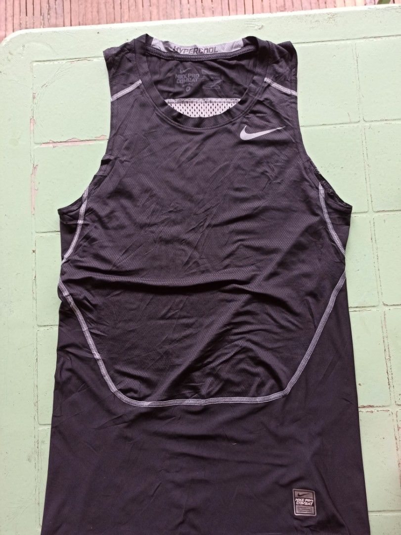 Nike Pro Combat Hypercool Men's Athletic Tank Top Black (Category: Activewear) located in Tagbilaran City. Submitted by delasierra39181 (Listing ID 1470065140, Image 1). Description: - Brand: Nike Pro Combat - Style: Hypercool athletic tank top - Color: Black - Features: Breathable mesh back panels for maximum ventilation, sleeveless fit, and classic Nike swoosh logo - Ideal for: Training, running, gym workouts, and sports.