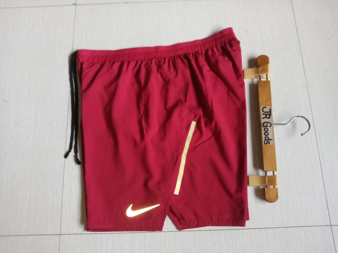 Nike Red Running Shorts (Category: Activewear) located in Tanay. Submitted by jrgoods (Listing ID 1470011803, Image 1). Description: Nlke dri-fit short XL fits large men's Above the knee Waistline 32-36 length 17.5 Good as new condition 750+ship Tanay Rizal location Shipping Nationwide - Condition: Brand new with store tags attached - Color: Red with black drawstrings - Features: Reflective silver Nike swoosh for visibility - Pocket: Convenient z
