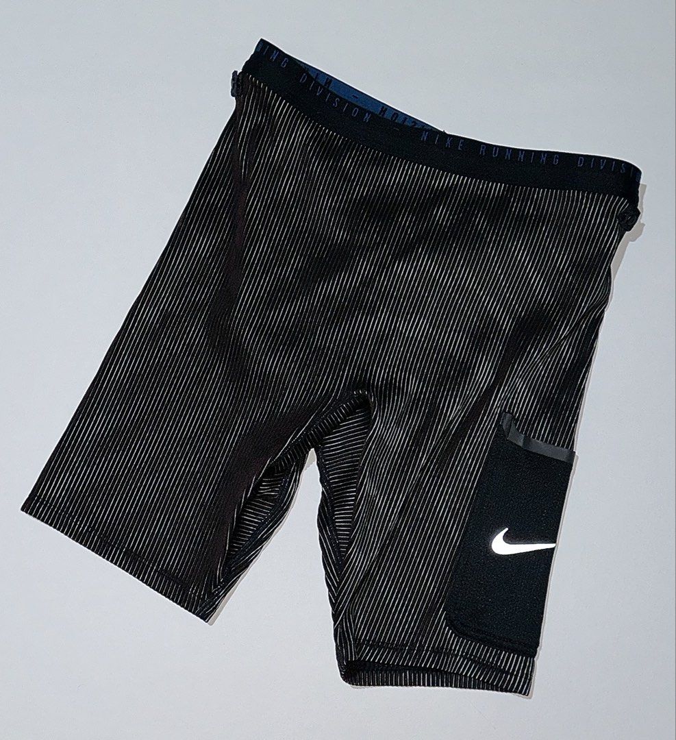 Nike Run Division 3-in-1 Half Tights (Category: Activewear) located in Manila. Submitted by reclaimed.shop (Listing ID 1470121088, Image 3). Description: Measurements (laid flat): 📏 Width: 26-32” 📏 Length: 16” Issue: Small tear on the pocket. This will be repaired before shipping. Please refer to the attached picture for reference. 📩 DM us to claim or inquire for more details! Thank you!.