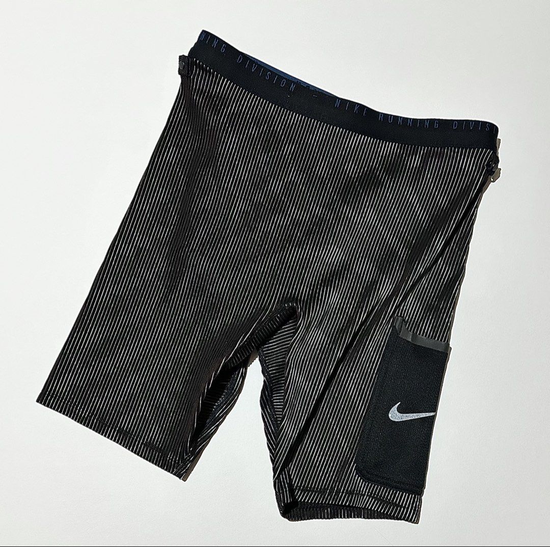 Nike Run Division 3-in-1 Half Tights (Category: Activewear) located in Manila. Submitted by reclaimed.shop (Listing ID 1470121088, Image 1). Description: Measurements (laid flat): 📏 Width: 26-32” 📏 Length: 16” Issue: Small tear on the pocket. This will be repaired before shipping. Please refer to the attached picture for reference. 📩 DM us to claim or inquire for more details! Thank you!.