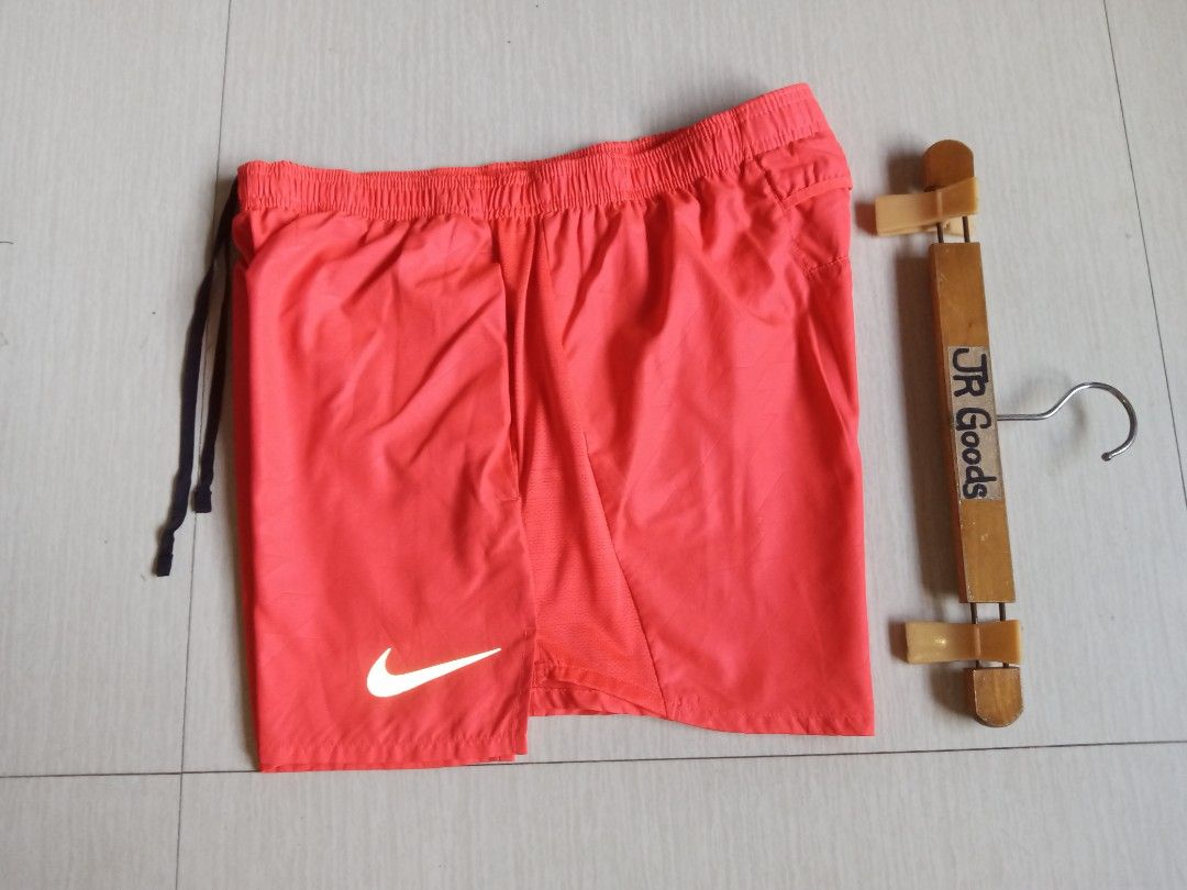 Nike Running Shorts (Category: Activewear) located in Tanay. Submitted by jrgoods (Listing ID 1470098488, Image 1). Description: Nlke running Large men's above the knee Waistline 32-36 Length 14.5 Good as new condition 650+ship Tanay Rizal location Shipping Nationwide - Elastic waistband with black adjustable drawstring - Reflective silver Swoosh logo on the lower left leg - Secure back zipper pocket for keys or small items - Mesh side panels for