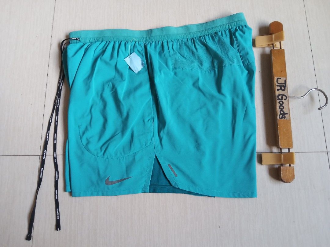 Nike Running Shorts Turquoise with Liner (Category: Shorts) located in Tanay. Submitted by jrgoods (Listing ID 1470098313, Image 1). Description: Nlke running w/ inner cycling XL fits Large men's above the knee Waistline 32-36 Length 14.5 Excellent to new condition 650+ship Tanay Rizal location Shipping Nationwide - Color: Vibrant Turquoise - Condition: Like new / Excellent - Built-in inner liner for added comfort and coverage - Secure zippered b