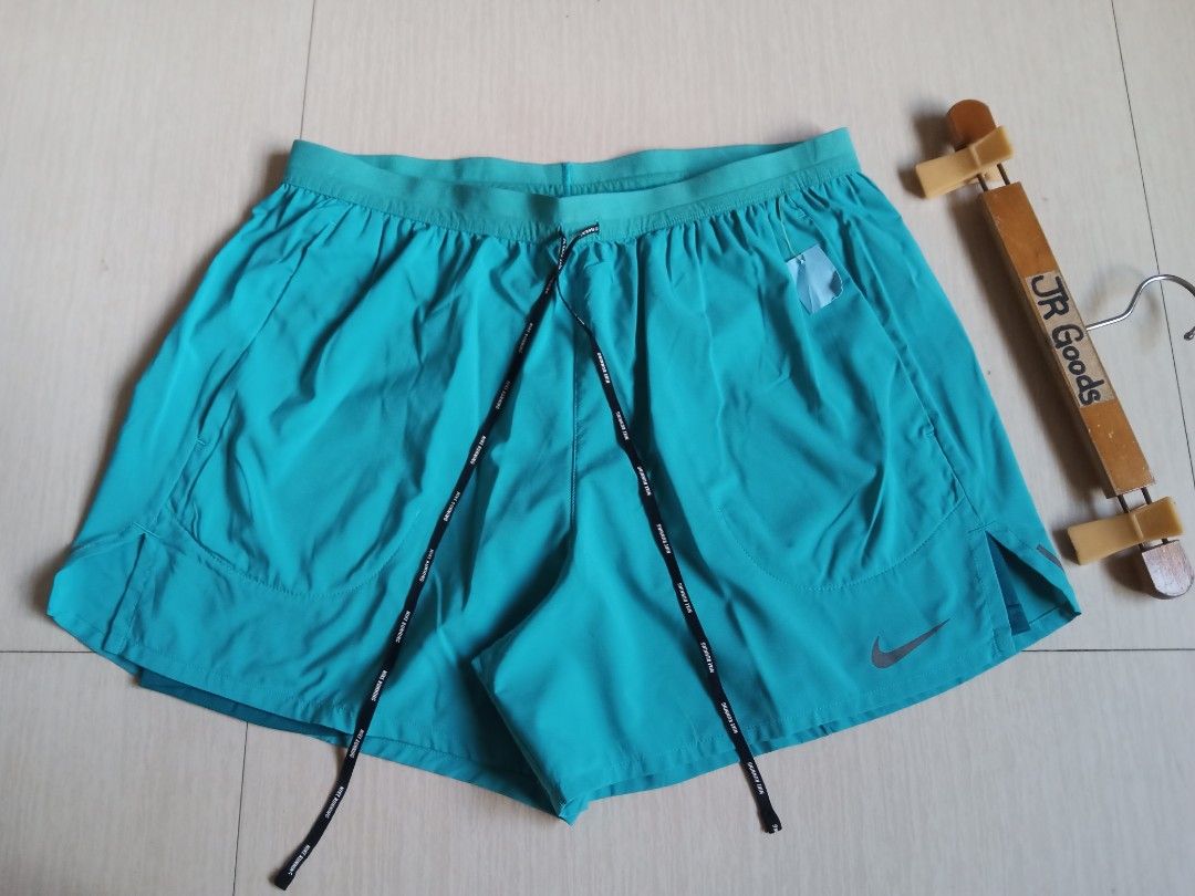 Nike Running Shorts Turquoise with Liner (Category: Shorts) located in Tanay. Submitted by jrgoods (Listing ID 1470098313, Image 3). Description: Nlke running w/ inner cycling XL fits Large men's above the knee Waistline 32-36 Length 14.5 Excellent to new condition 650+ship Tanay Rizal location Shipping Nationwide - Color: Vibrant Turquoise - Condition: Like new / Excellent - Built-in inner liner for added comfort and coverage - Secure zippered b