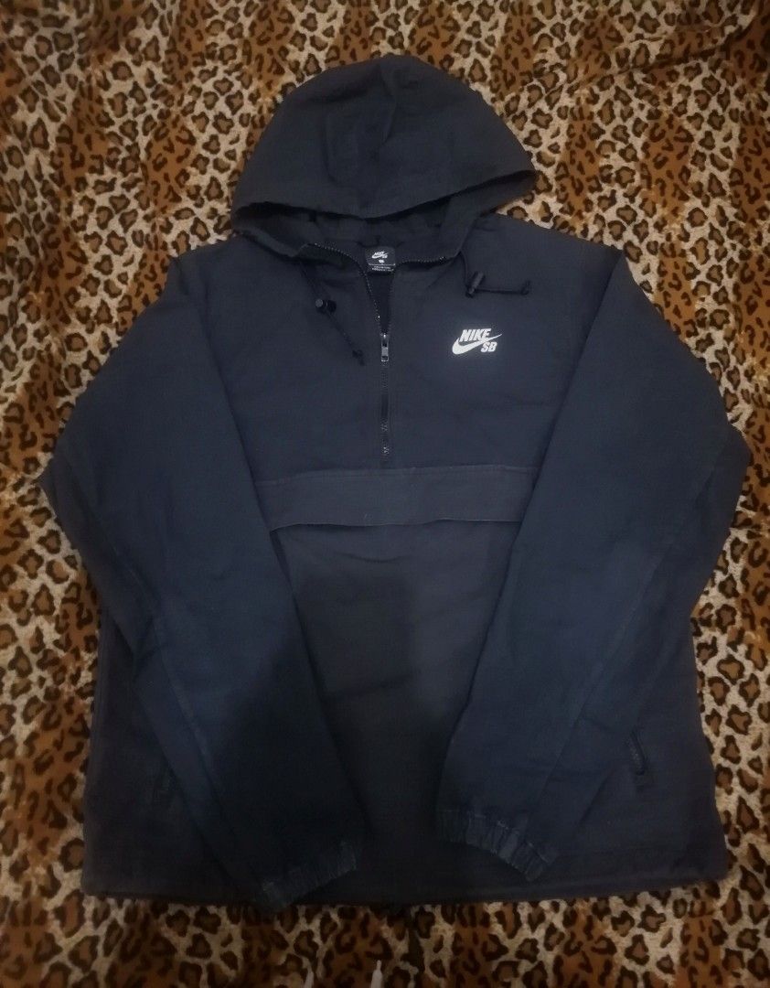 Nike SB Black Anorak Hoodie Jacket (Category: Coats, Jackets and Outerwear) located in Cebu City. Submitted by roadthrift (Listing ID 1470135299, Image 1). Description: - Brand: Nike SB - Item: Anorak Jacket with Hood - Color: Black with white chest logo - Size: L (fits height 170-180 cm) - Material: 97% cotton, 3% spandex - Features: Half-zip front, front kangaroo pocket, adjustable hood drawstrings - Condition: Clean and well-maintained.